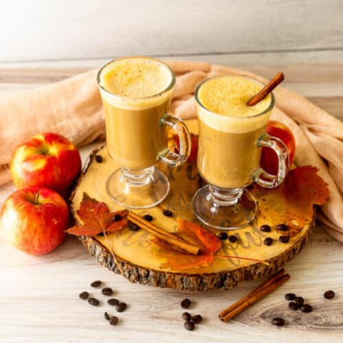 Warm Apple Pie Latte with Cinnamon Sticks and extra apples
