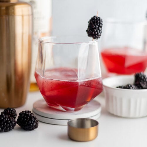 Blackberry Old Fashioned in a rocks glass with blackberry garnish
