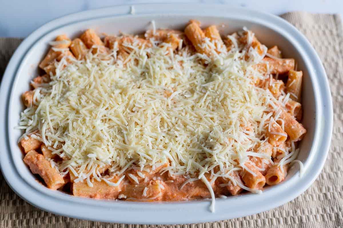 5 ingredient baked ziti topped with mozzarella cheese and parmesan cheese