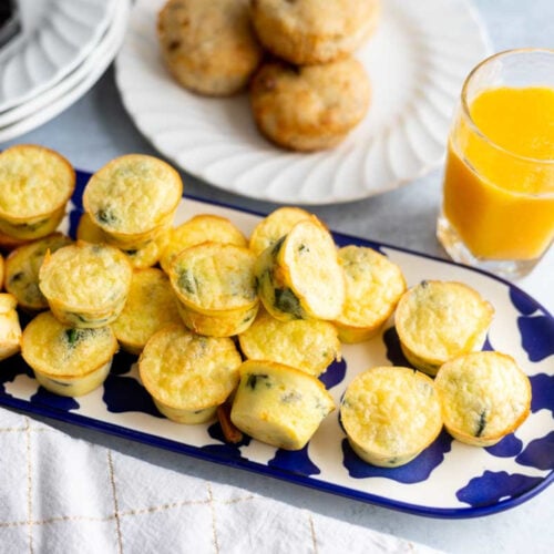 Sauteed Mushroom and Spinach Egg Bites on a blue tray